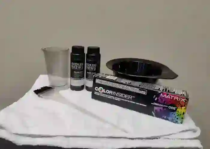 Professional men's hair coloring products, mixing bowl, and application brush used by stylists at MadMen Haircuts, Midtown Manhattan's premier hair salon.